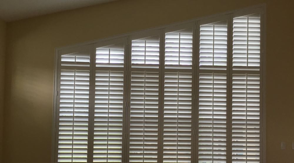 Angle/Rake Window Treatments Angled window with plantation shutters